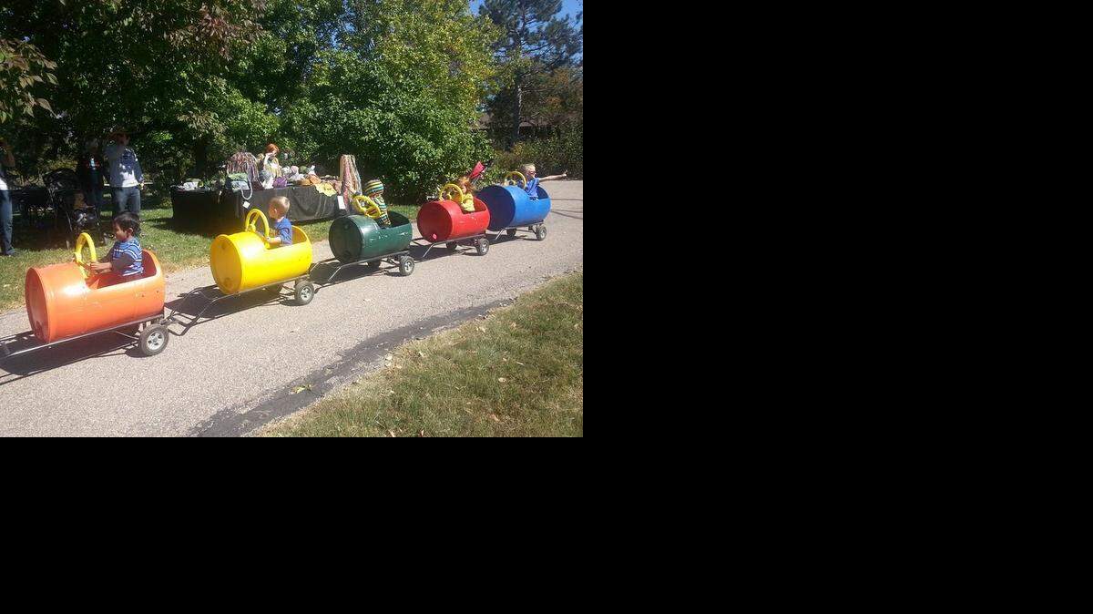 
Children ride the barrel train at the Prairie Pumpkin Festival at Dyck Arboretum of the Plains in Hesston.
