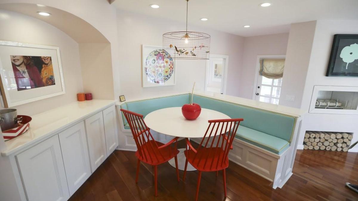 Pops of color, whimsy and vintage photography brighten the Michaelis kitchen, part of the Junior League's kitchen tour next weekend. The colors of the banquette were inspired by those on a box of Cipriani pasta.