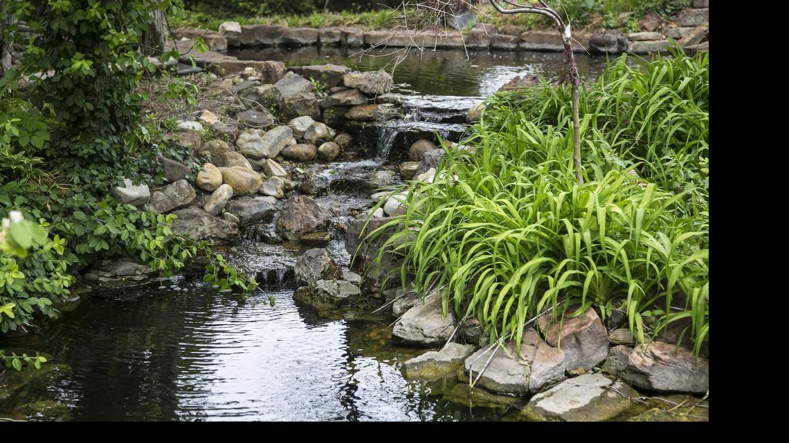 
Waterfalls provide soothing sounds to mask traffic. Scenic Landscapes has examples of several ponds and waterfalls, like this one, at its nursery.
