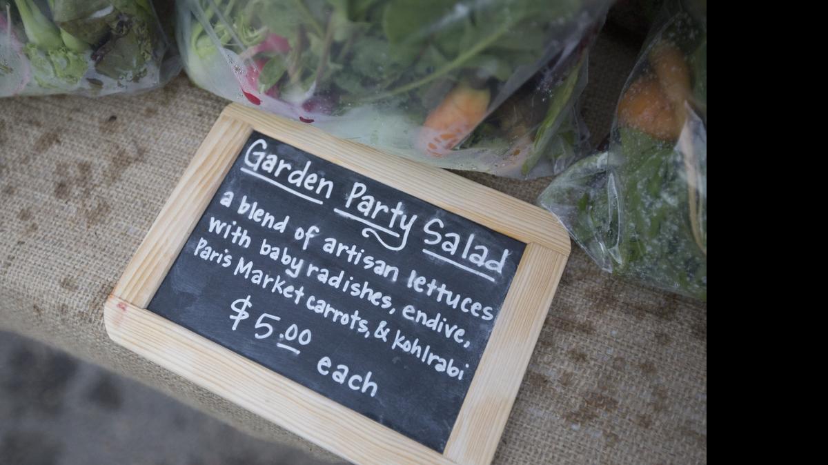 
Chalkboard signs and colorful produce combos give Orie’s Farm Fresh a trendy look in its first year at the Kansas Grown Farmers Market, at 21st and Ridge Road.
