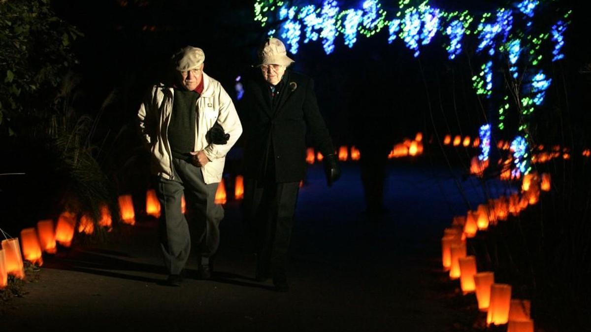 Dick Weidenbach, one of the orginal Botanica board members, is shown walking with Dorothy Ryan in 2004 during Botanica’s holiday Illuminations.