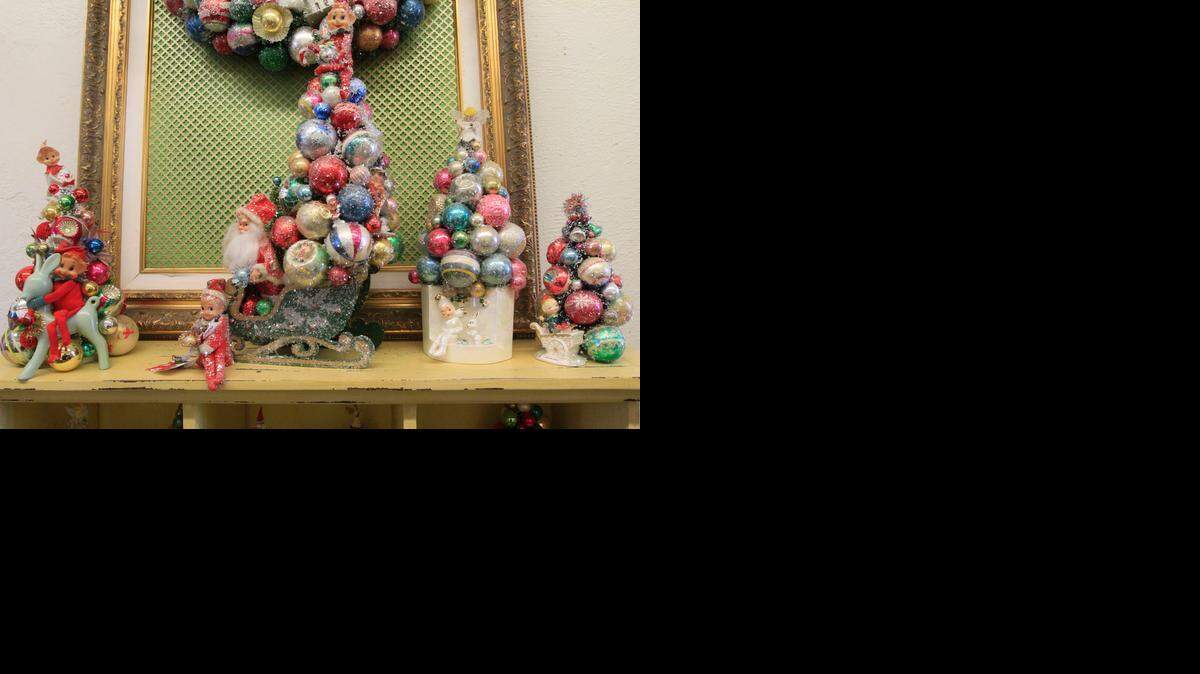 
Vintage containers and ornaments – some of them glazed with artificial snow – are the creations of Wichita seamstress Felicia Serrioz.
