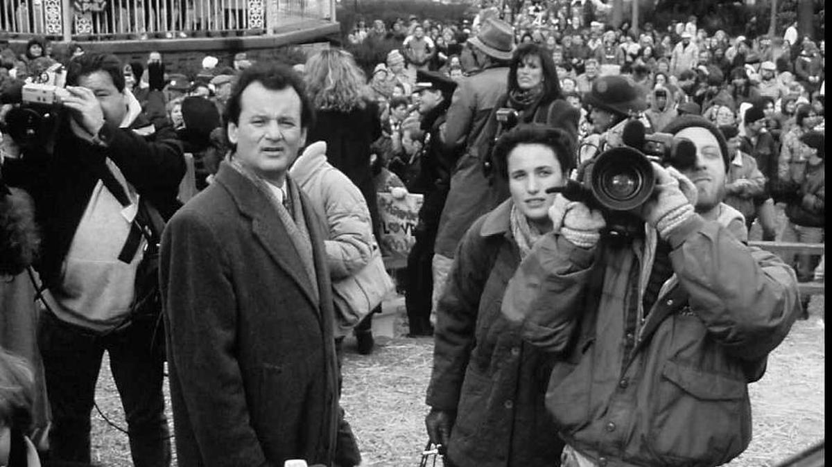 Phil (Bill Murray), Rita (Andie MacDowell), and Larry (Chris Elliott) await the arrival of the groundhog in “Groundhog Day.”