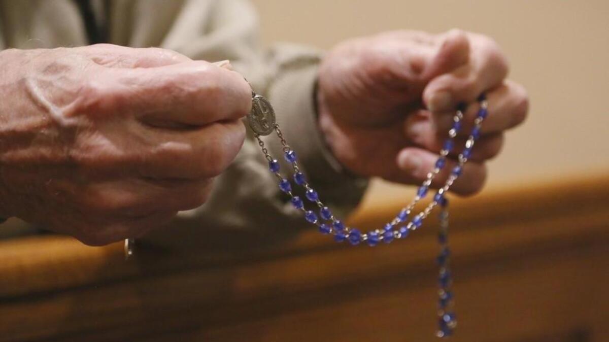 Bob Knoff, with his rosary beads, prays during perpetual Eucharistic adoration at Church of the Blessed Sacrament. Knoff has been praying at the 3 a.m. adoration shift for 33 years. (April 11, 2017)