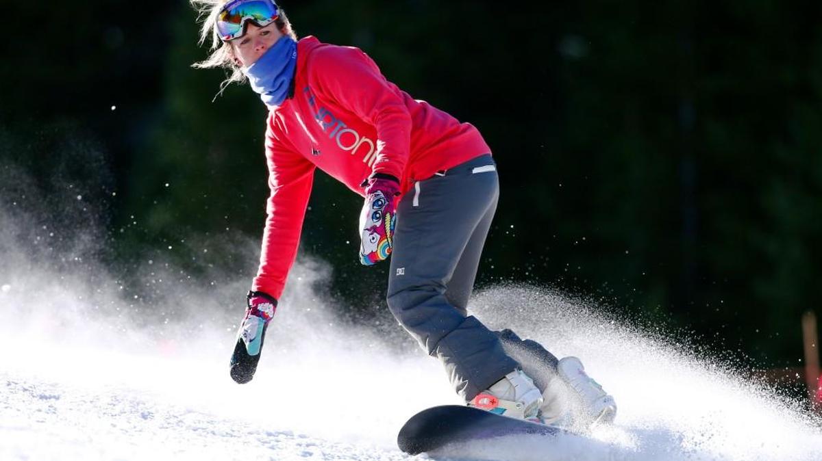 A snowboarder carves a turn on the opening day of ski season at Arapahoe Basin Ski Area in Colorado Oct. 13. Colorado’s ski resorts have lots of new offerings for the season, from mountain roller coasters to new terrain and lifts. Arapahoe Basin is opening 468 new skiable acres.