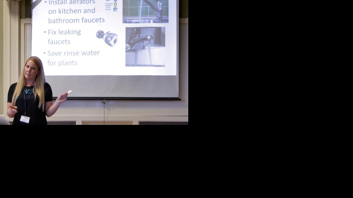 
Amanda Bunte, a representative with the City of Santa Cruz, goes over water conservation tips during Water School in Santa Cruz, Calif., in July.

