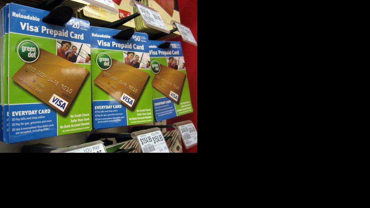 
Visa prepaid cards are on display at a drug store in New York in 2010. New rules unveiled Thursday by the Consumer Financial Protection Bureau would protect prepaid card users against unauthorized charges and provide them with monthly billing statements.
