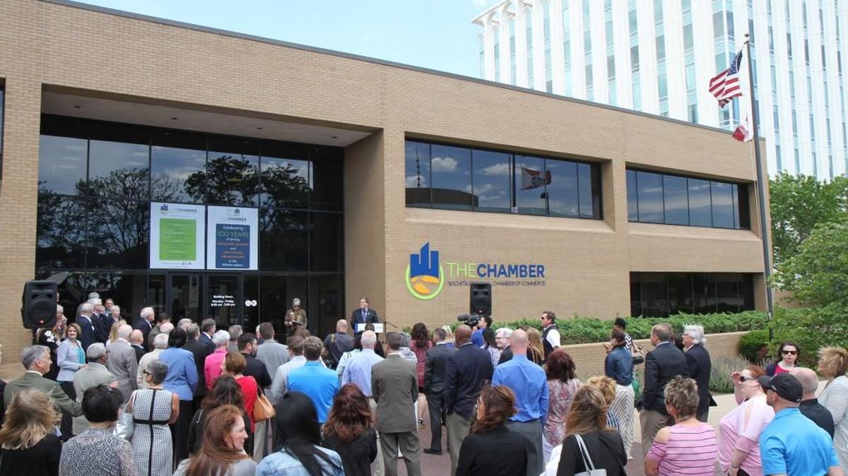 About 100 people attended a Wichita Regional Chamber of Commerce ceremony and ribbon cutting Thursday marking its 100th anniversary and completion of renovations to its downtown headquarters building at 350 W. Douglas.