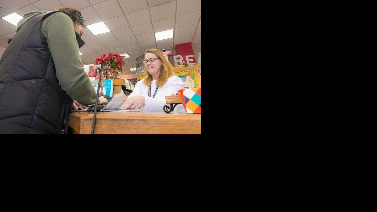 
Melissa Fox, bookseller, helps Julie Kice of Wichita at Watermark Books on Tuesday. Watermark is among a number of stores that has supported federal legislation requiring all retailers, including those who operate online, to assess sales taxes on customers’ purchases.
