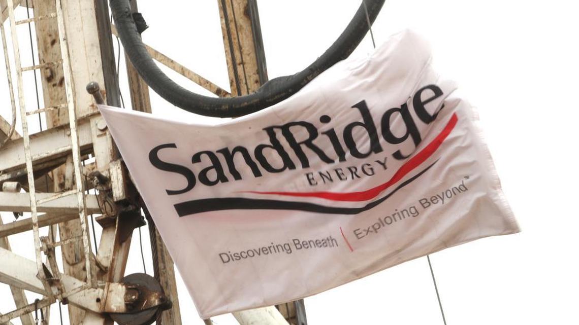 A SandRidge Energy flag flies over one of several drilling rigs operating in southern Kansas near the Oklahoma border in 2012.
