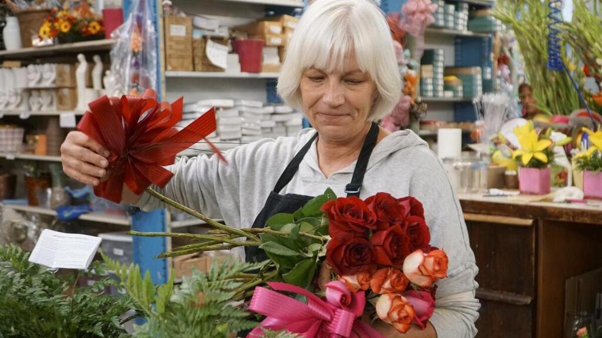 Deena Snyder disassembles a floral arrangement at Tillie's Flower Shop. Wichita finally seems be feeling some of the love from the ongoing economic recovery.