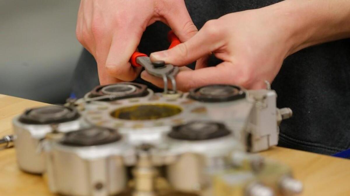 A Wichita Area Technical College student works on a landing gear brake during an aircraft maintenance job training program in 2014. Federal funding for job training in critical industries such as aviation has been declining over the past couple of years.
