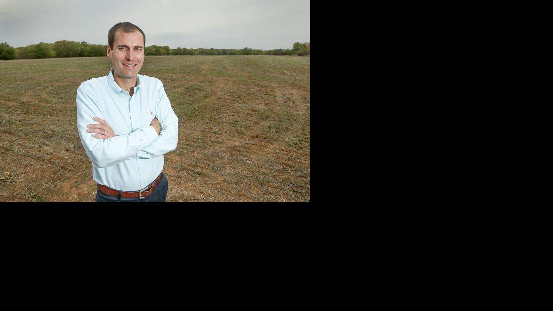 
Weigand real estate broker John Rupp stands in front of 160 acres of land that he wants to sell just north of 85th North and 127 St. East Thursday. 
