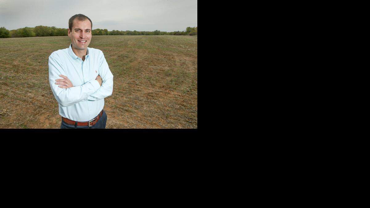 
Weigand real estate broker John Rupp stands in front of 160 acres of land that he wants to sell just north of 85th North and 127 St. East Thursday. 
