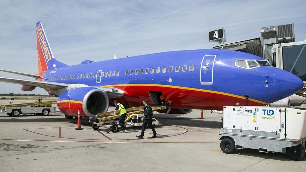 Ground crews and baggage handlers service a Southwest Airlines jet at Wichita Eisenhower National Airport on March 23. Southwest begins new service to Phoenix and St. Louis April 12 in lieu of to Dallas Love Field and Chicago Midway.