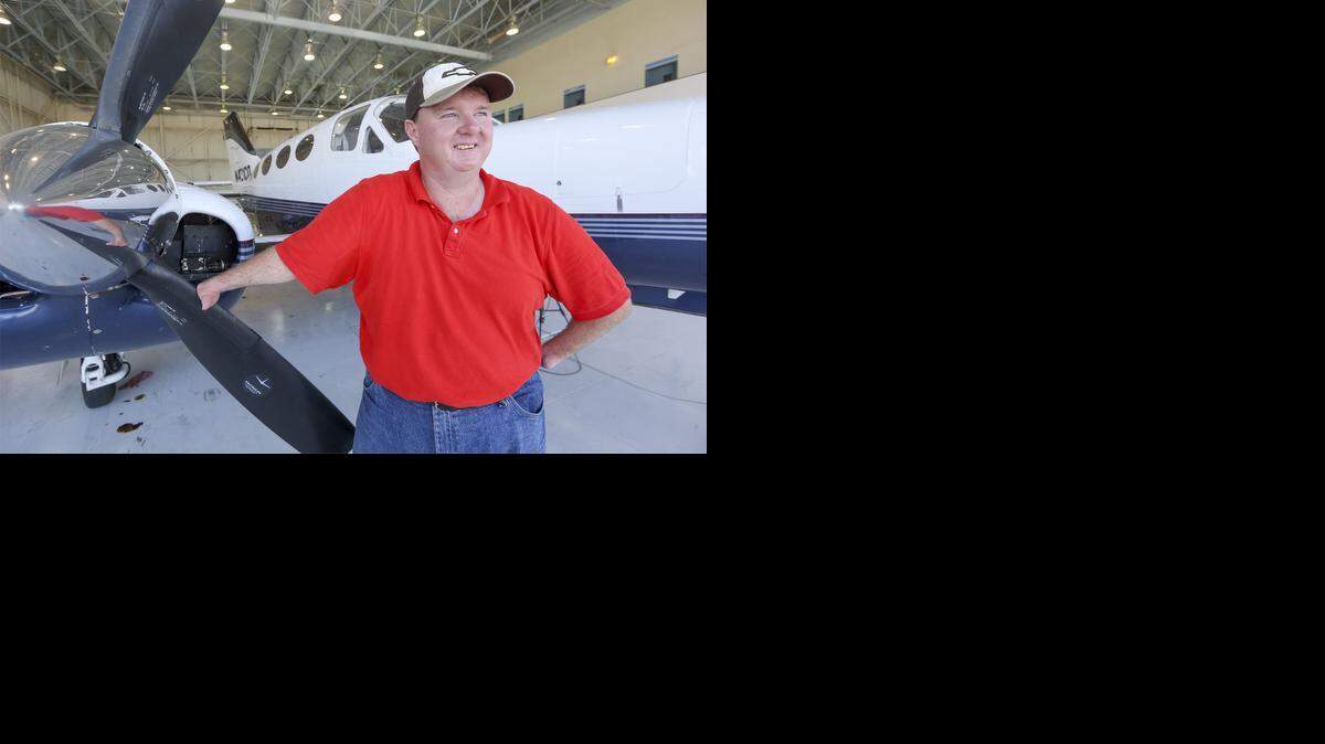 
Randy Green stands by the Cessna 421 he had been training on Thursday at Jabara Airport. He is training to become a corporate pilot. (Sept. 4, 2014)
