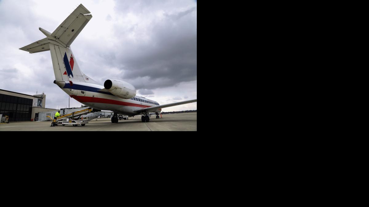 
Baggage handlers unload an American Eagle jet after it landed at the Abraham Lincoln Capital Airport in Springfield, Ill in 2013. The regional airline industry may soon face the kind of consolidation that thinned the ranks of the largest airlines from eight between 2008 and the end of 2013. 
