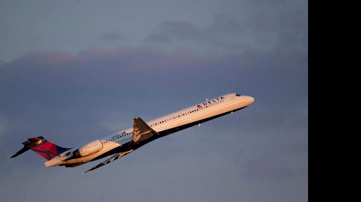 
A Delta Air Lines Inc. McDonnell Douglas MD-90 airplane departs Ronald Reagan National Airport in Washington, D.C., last July. After rising steadily for years, airfares this summer are expected to be, on average, about the same as last summer. 
