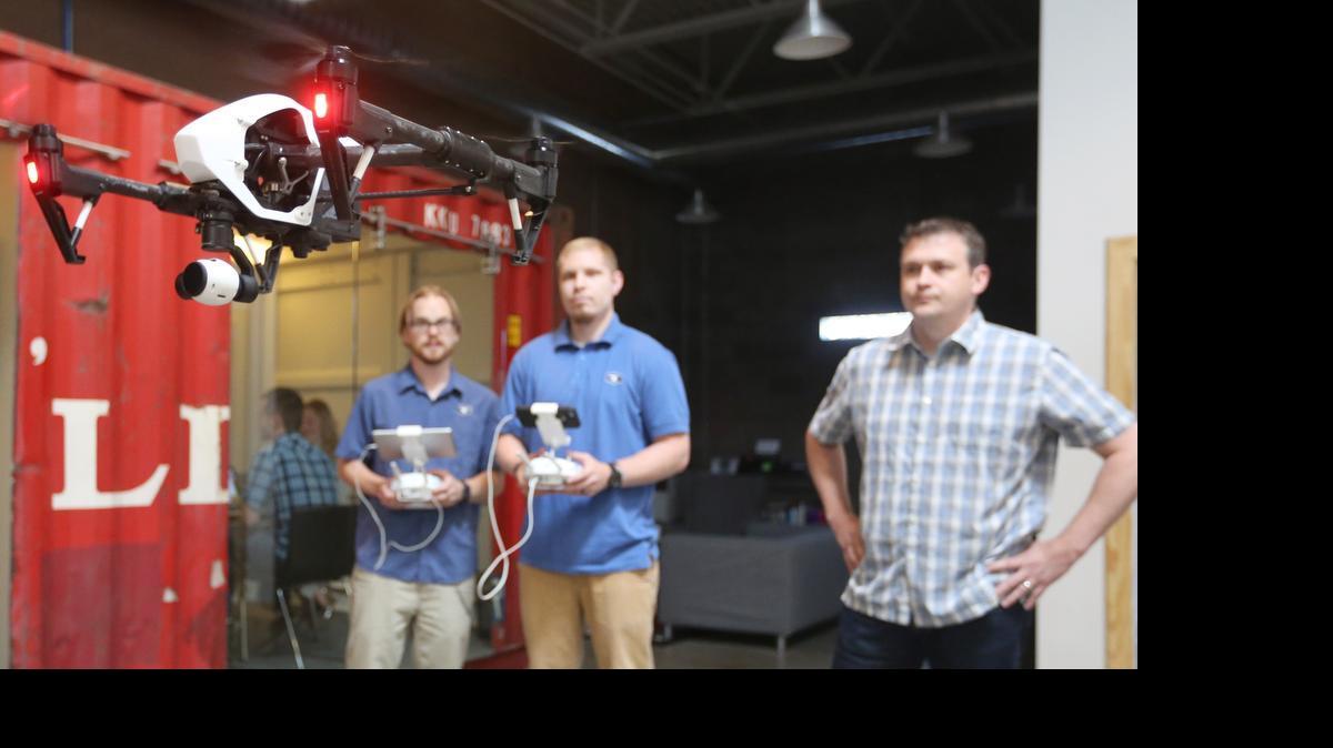 
From left, RSA Marketing Services employees Naythan Smith, Andre Kahmeyer and Clint Herring work with a drone inside the company’s offices at 400 S. Commerce. Smith was operating the camera, Kahmeyer was piloting the drone, and Herring was helping them do both.  (June 9, 2015)

