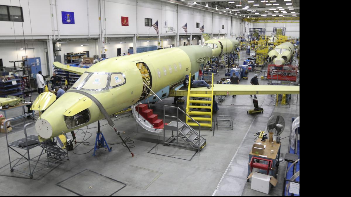 
Textron Aviation employees assemble a Cessna Citation Latitude business jet at the company’s west-side plant in February. Deliveries of the Latitude, the company’s newest jet, are expected to begin in the third quarter of 2015, Textron Inc. CEO Scott Donnelly said Tuesday. 
