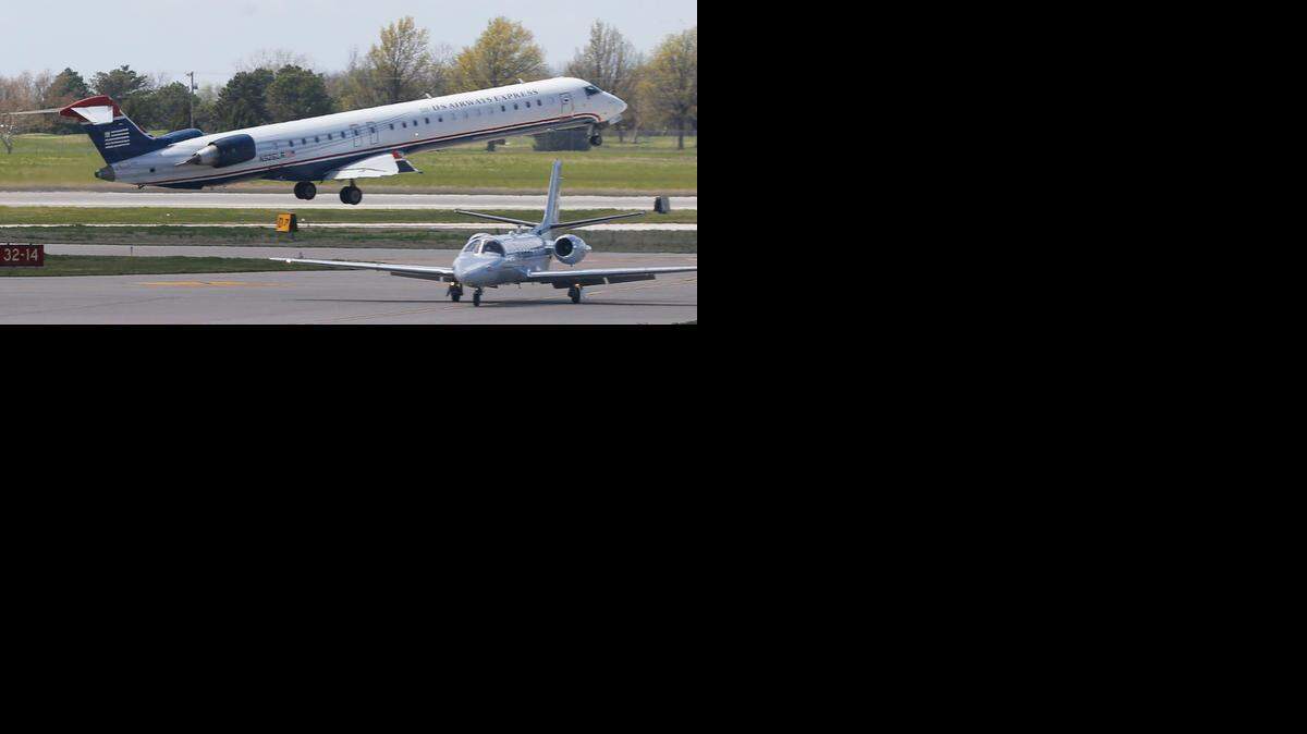 
A U.S. Airways regional jet takes off from Wichita Eisenhower National Airport on Thursday. 
