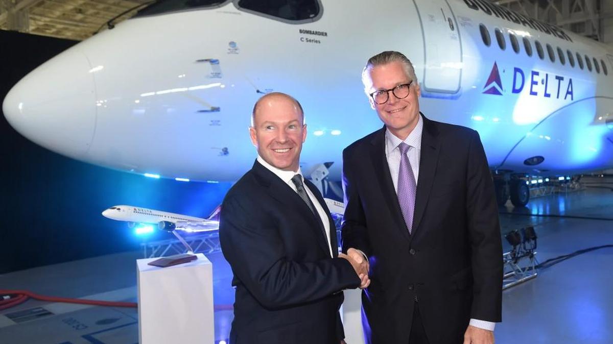 Alain Bellemare, left, president and CEO of Bombardier Inc., shakes hands with Delta Air Lines CEO Ed Bastian, following last year’s order announcement from Delta for up to 125 C Series jets.