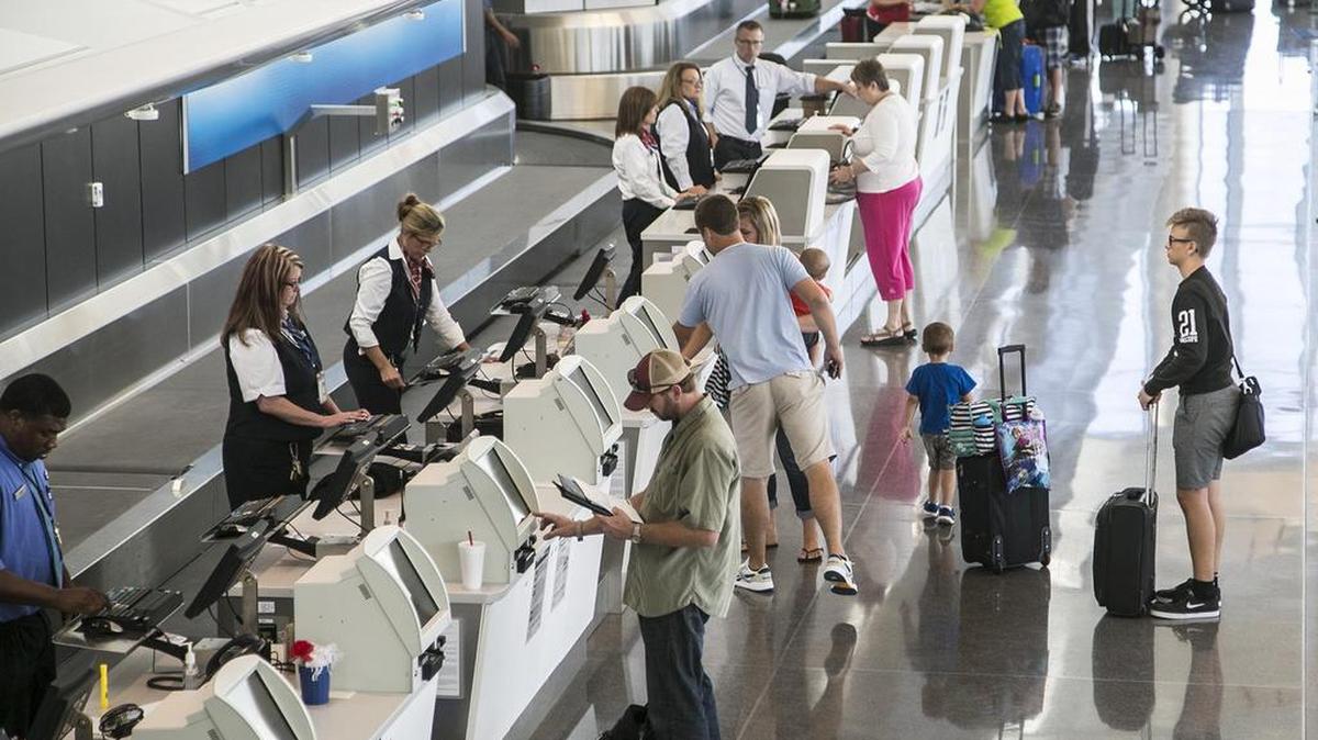
Travelers line up at the ticket counters in the terminal of Wichita’s Eisenhower National Airport. (Sept. 9, 2015)

