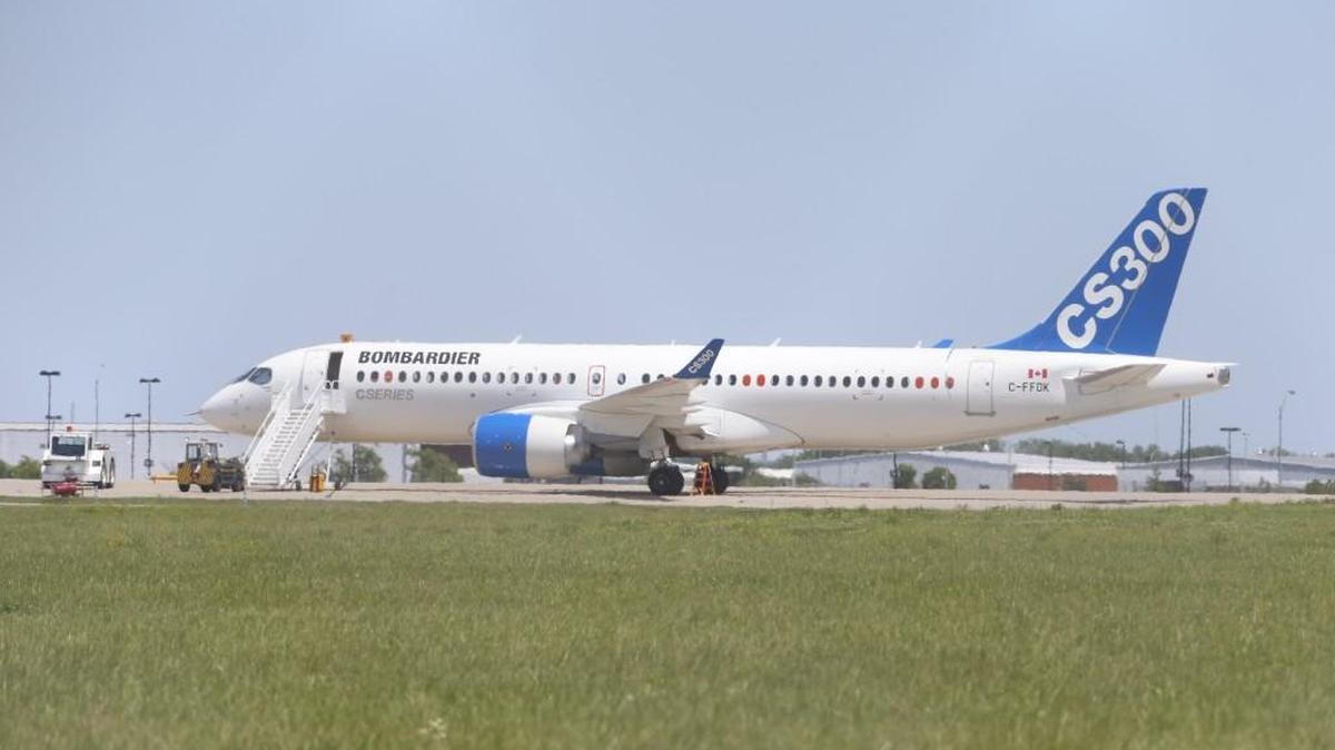 A Bombardier C Series CS300 jetliner sits on the ramp at Wichita Eisenhower National Airport in June. Bombardier cuts its C Series delivery forecast for 2016 because engine supplier Pratt & Whitney is having production issues with its new Geared Turbofan engine.