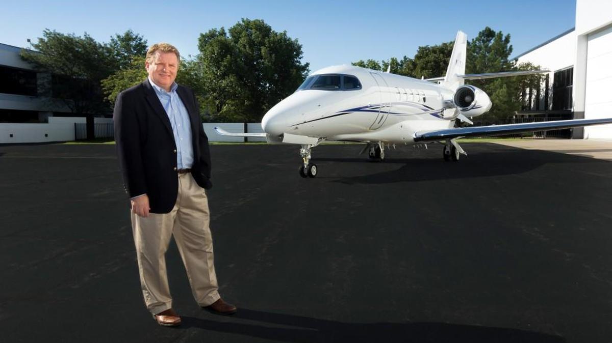 
John Sieckowski of Aircraft Management Group stands with the company’s recently delivered Cessna Citation Latitude business jet at Textron Aviation’s West Campus.
