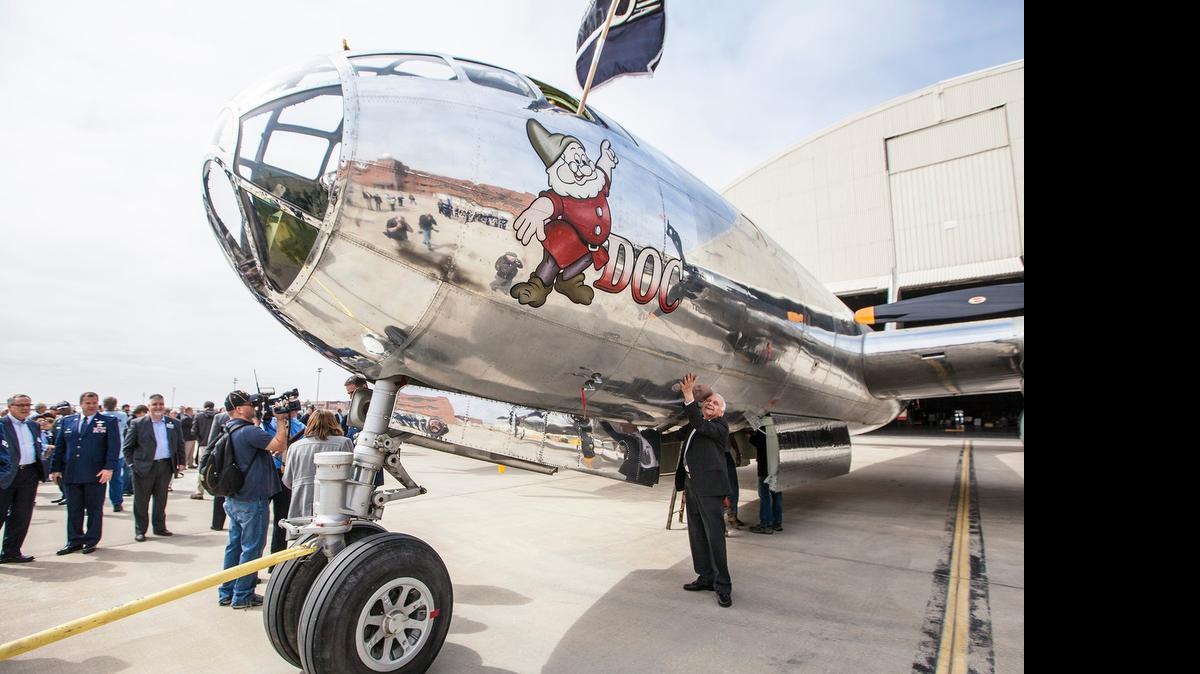 
Tony Mazzolini hugs the fuselage of "Doc." He recovered the Boeing B-29 Superfortress from the California desert in 1987. The airplane marked a milestone in the nearly 15-year restoration effort during a roll-out ceremony in March. The airplane was part of a squadron known as Snow White and the Seven Dwarfs. (Mar. 23, 2015)
