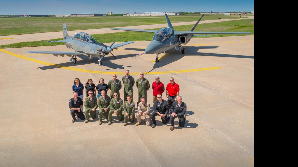 
U.S. Air Force Test Pilot School and Textron Aviation test pilots, instructors and support crew pose with the Scorpion and Beechcraft AT-6 in Wichita in late April.
