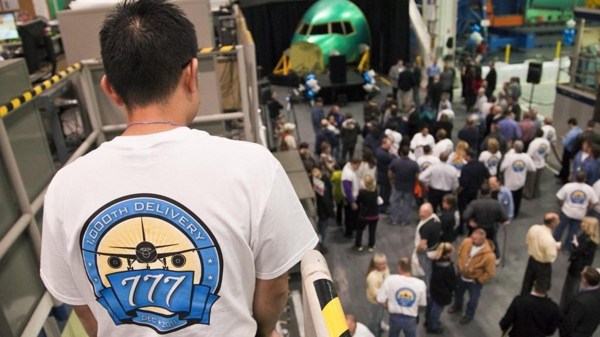Spirit AeroSystems workers gather for the 1,000th Boeing 777 forward fuselage section rollout ceremony at Spirit in December 2011.