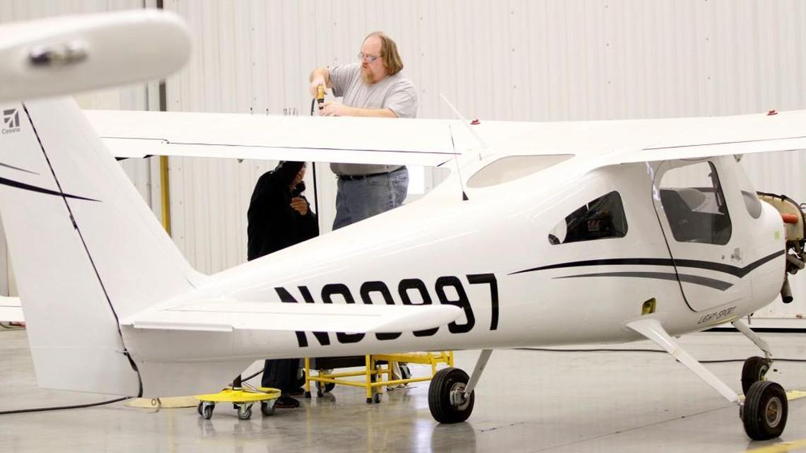 Employees assemble a Cessna Skycatcher at Textron Aviation’s Independence plant in 2013.