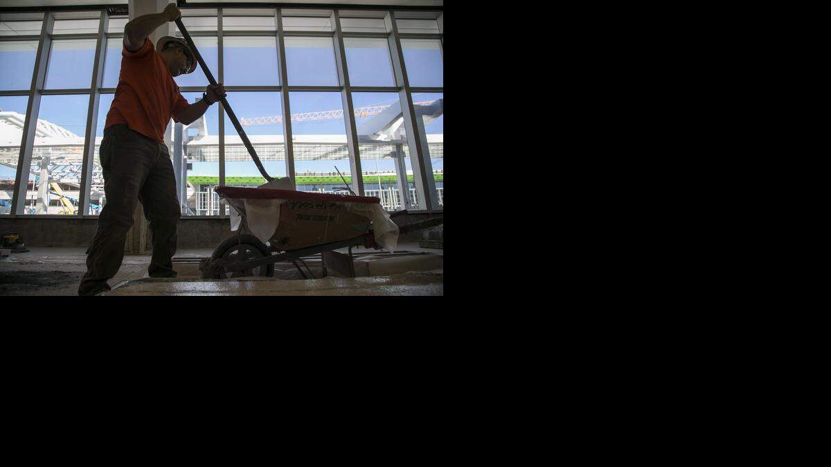 
A worker mixes flooring aggregate as construction continues on the Wichita Mid-Continent Airport terminal. (Nov. 6, 2014)
