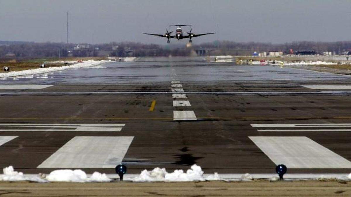 A commuter airliner takes off on the long runway at Salina Municipal Airport in December 2004.