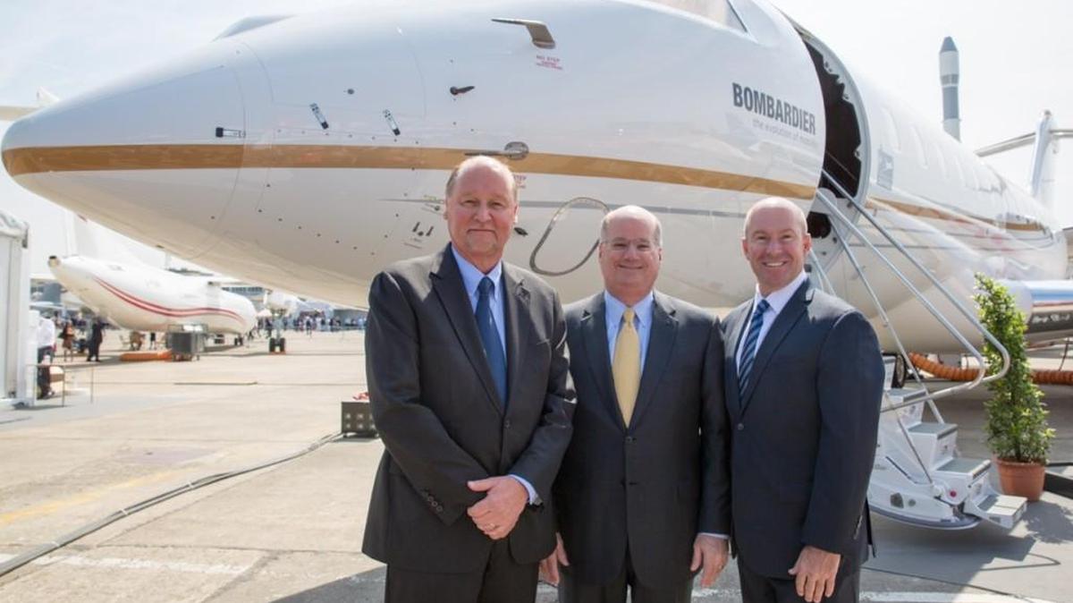 From left, Rick Yuse of Raytheon, Orlando Carvalho of Lockheed Martin and Alain Bellemare of Bombardier pose next to a Global 6000 business jet for an announcement that the three companies will compete as a team for the Air Force’s next generation of Joint Surveillance Target Attack Radar System, or JSTARS, aircraft.