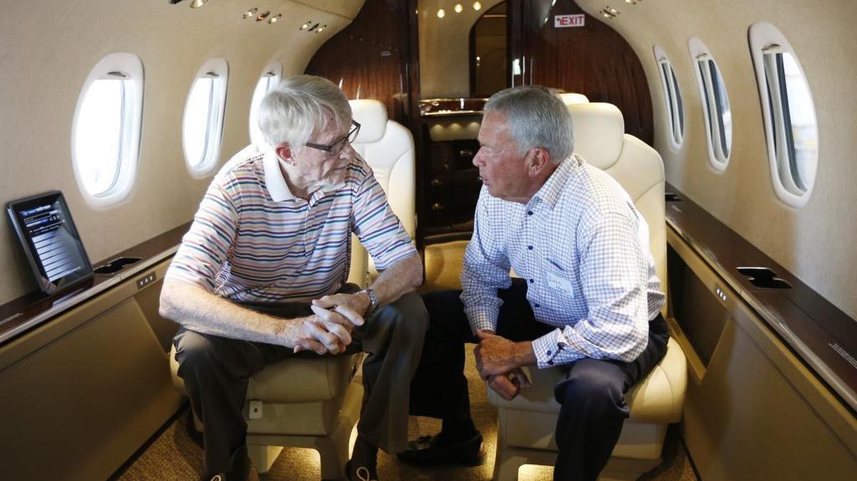 
Jack DeBoer, left, chats with Cessna chairman emeritus Russ Meyer while seated in a new Cessna Citation Latitude jet Monday afternoon before the start of a Wichita Aero Club reception at DeBoer’s Wichita Air Services hangar. (July 13, 2015)
