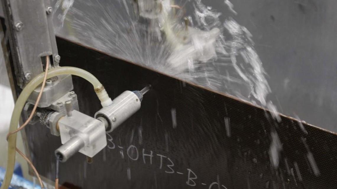 A machine tests a piece of composite material in the composites lab at Wichita State University’s National Institute for Aviation Research. (Oct. 22, 2008)