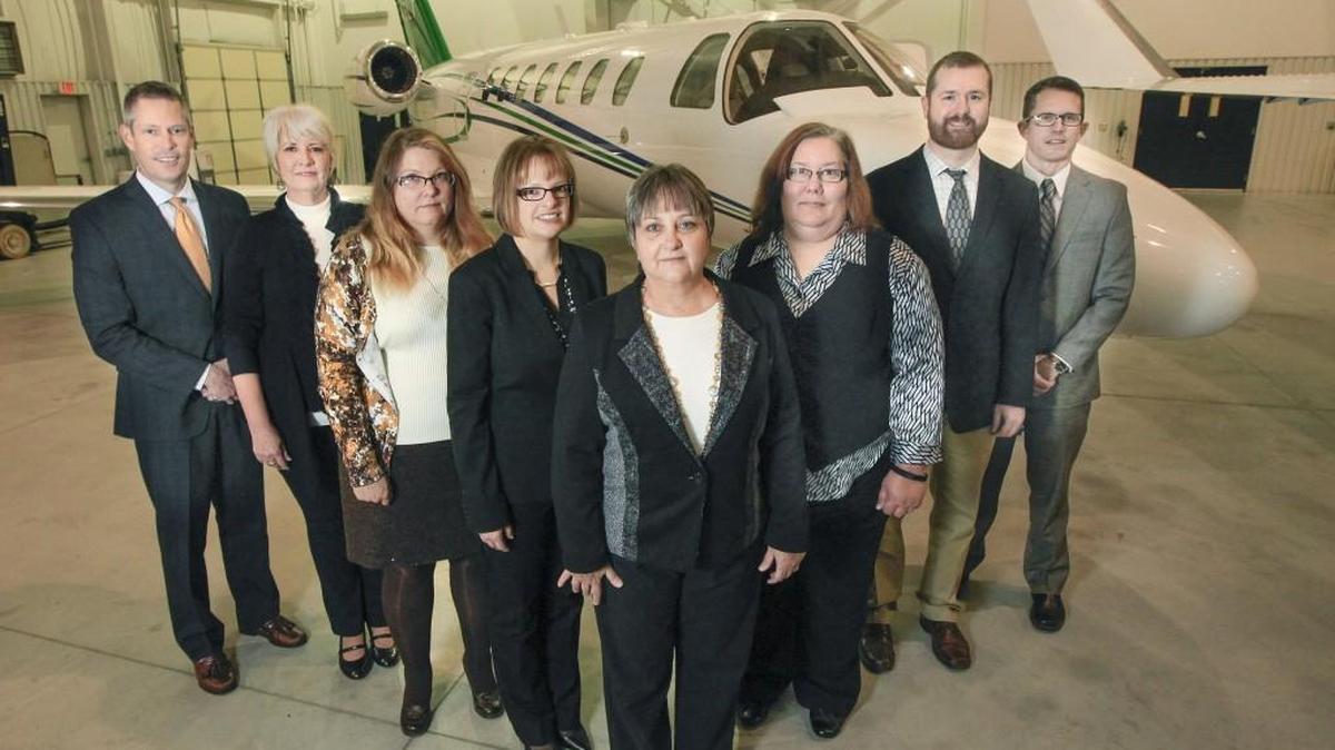 From left, the IMA aviation team at Jabara Airport are Brian Burrus, Shelley Petty, Steph Lister, Andrea Merrigan, Janell Hyatt, Diane Brinklow, Ted Myers and Drew Johnston.