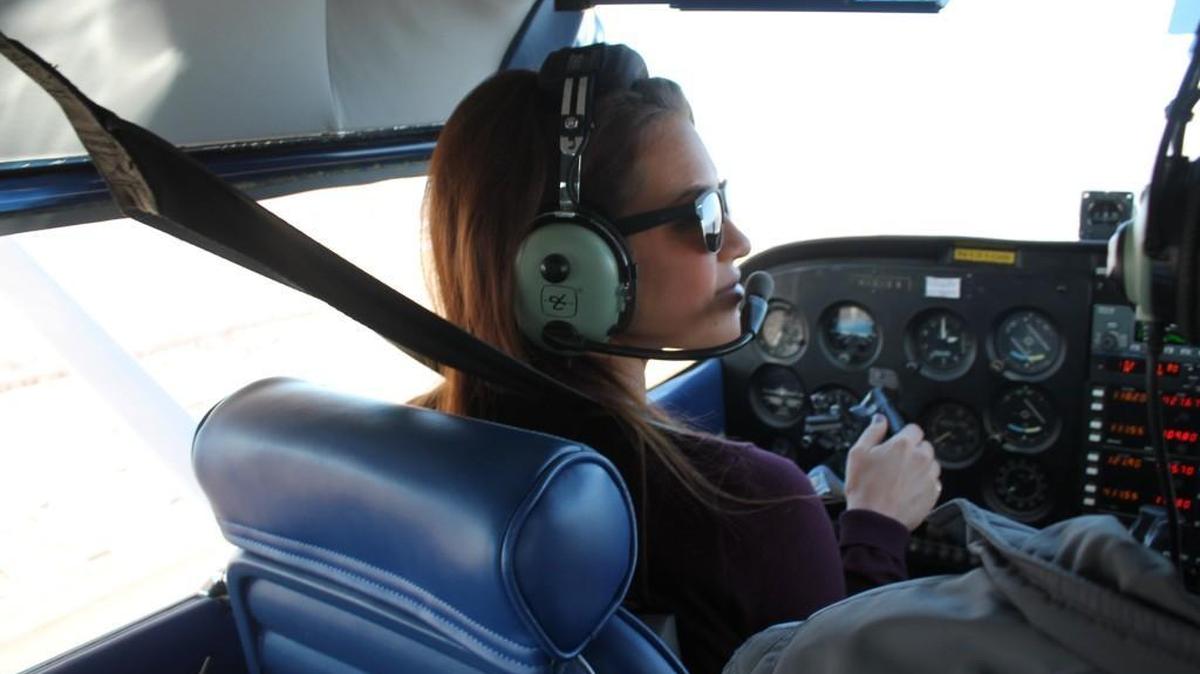 Marketing director Sarah Johnson pilots Bevan-Rabell’s Cessna 172 during flight training earlier this month with instructor Matt Anker. Johnson is one of several employees at the Wichita-based avionics and aircraft repair company who are able to use its airplane rent-free.