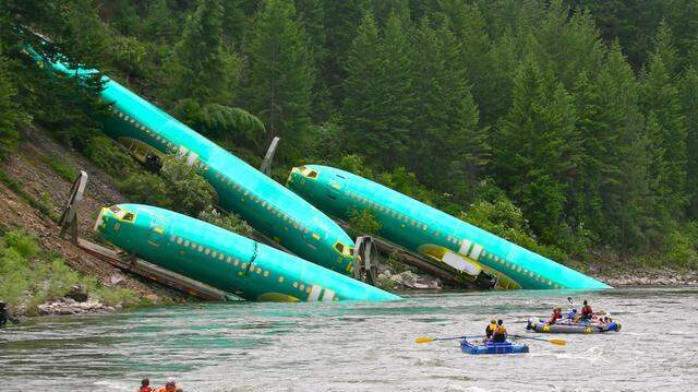 
Kyle Massick, a photographer for a river rafting company in Montana, shot this photo July 4, 2014, that shows Boeing 737 fuselages partially in the Clark Fork River after the railcars that were carrying them derailed from the tracks adjacent to the river. The 737 fuselages were built at Spirit AeroSystems in Wichita and were on their way to the Boeing plant in Renton, Washington for final assembly. 
