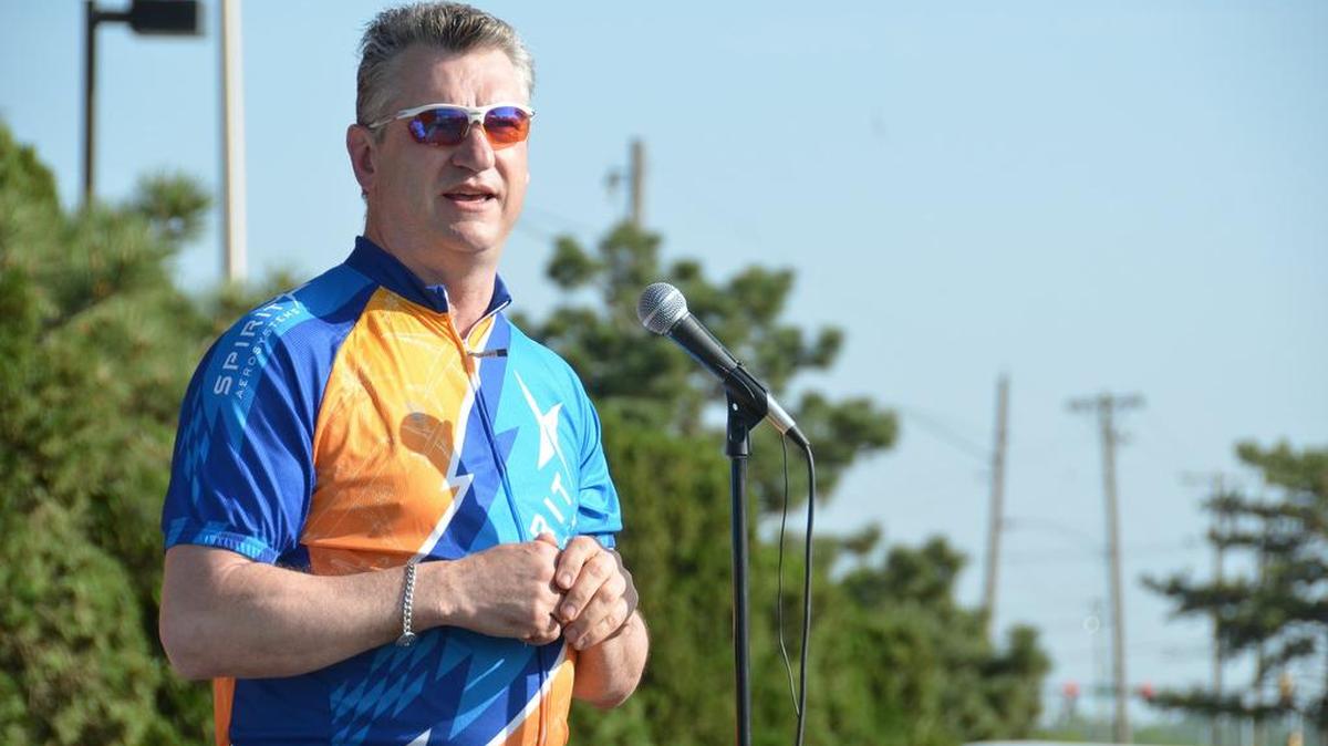 Spirit AeroSystems CEO Larry Lawson speaks at the American Diabetes Association’s Tour de Cure cycling fundraiser earlier this year.