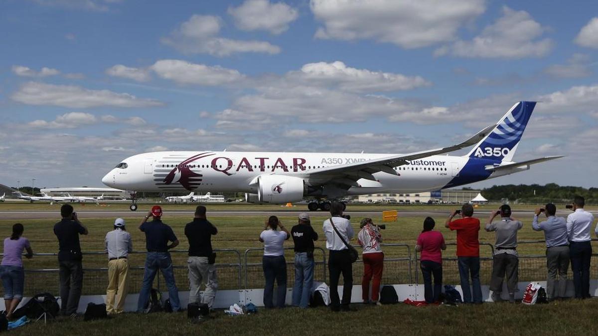 Visitors watch an Airbus A350 XWB takes off for a flying display during the Farnborough International Air Show, Farnborough, England, in 2014.