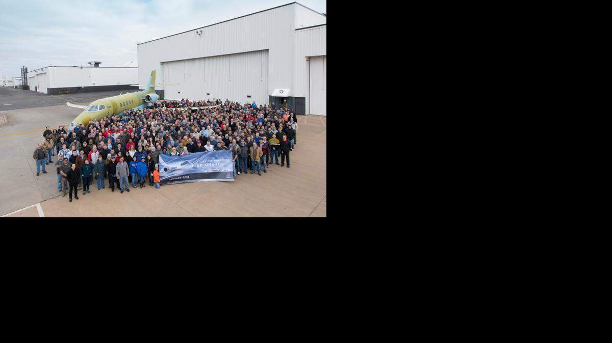 
Textron Aviation employees mark the rollout of the first production Cessna Citation Latitude business jet Thursday.

