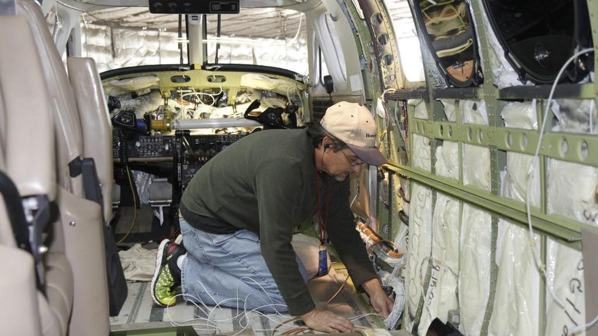 Bevan-Rabell avionics technician Charles Smitley works on a Beechcraft King Air on Wednesday that will be used by the U.S Forest Service for firefighting operations. (Nov. 30, 2016)