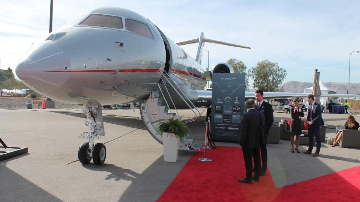 Customers stand outside a Bombardier Global 5000 business jet at the 2015 National Business Aviation Association static display at Henderson Executive Airport near Las Vegas. Bombardier Business Aircraft on Wednesday said it was terminating some third-party sales and distribution agreements, including one that was focused on the sales and delivery of Global business jets in the Middle East and North Africa.