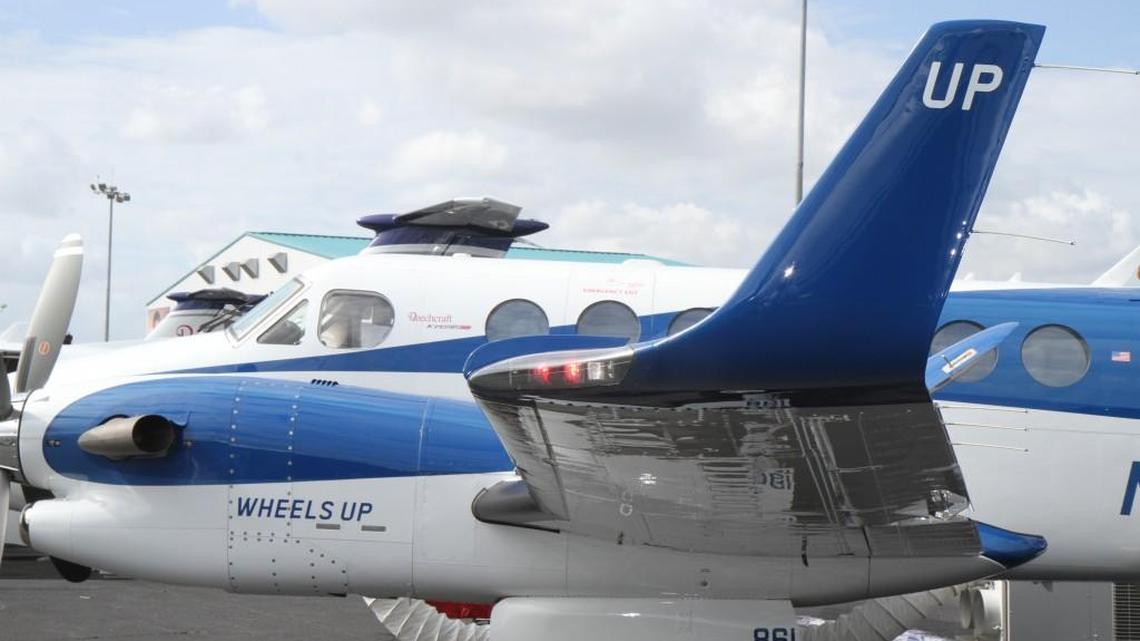 A Wheels Up Beechcraft King Air 350i sits on display at the Orlando Executive Airport during the 2016 National Business Aviation Association Convention. The private aviation membership firm is among the companies that could be creating an environment allowing more people access to travel on business aircraft.