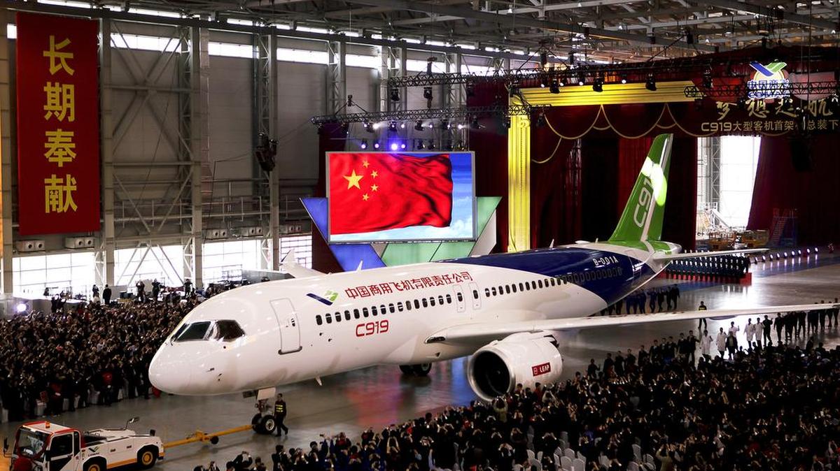 The first twin-engine 158-seater C919 passenger plane made by the Commercial Aircraft Corp. of China is pulled out of the company’s hangar during a ceremony near the Pudong International Airport in Shanghai, China, Monday, Nov. 2, 2015. The first plane produced by a Chinese government initiative to compete in the market for large passenger jetliners has been unveiled in Shanghai.