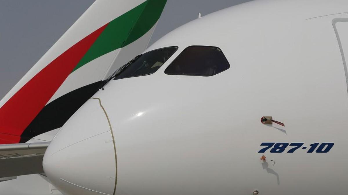 A Boeing 787-10 Dreamliner is parked in front of an Emirates Airline plane during the opening day of the Dubai Air Show, United Arab Emirates, on Sunday. The biennial Dubai Air Show opened Sunday with hometown long-haul carrier Emirates making a $15.1 billion buy of American-made Boeing 787-10 Dreamliners, as the world's biggest defense companies promoted their weapons amid heightened tensions between Saudi Arabia and Iran.