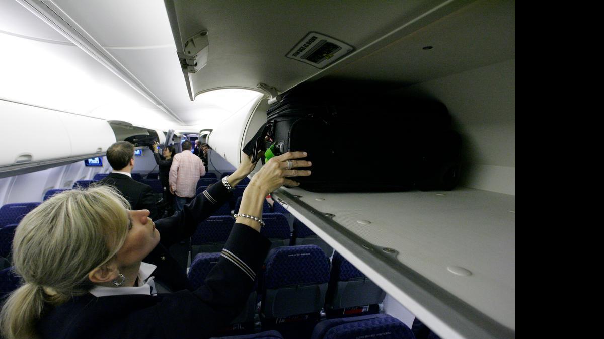 
A global airlines industry group proposed on Tuesday a new standard for carry-on bags. The new maximum size would be smaller than what most U.S. airlines now allow, and would allow more passengers to fit their bags in overhead bins.
